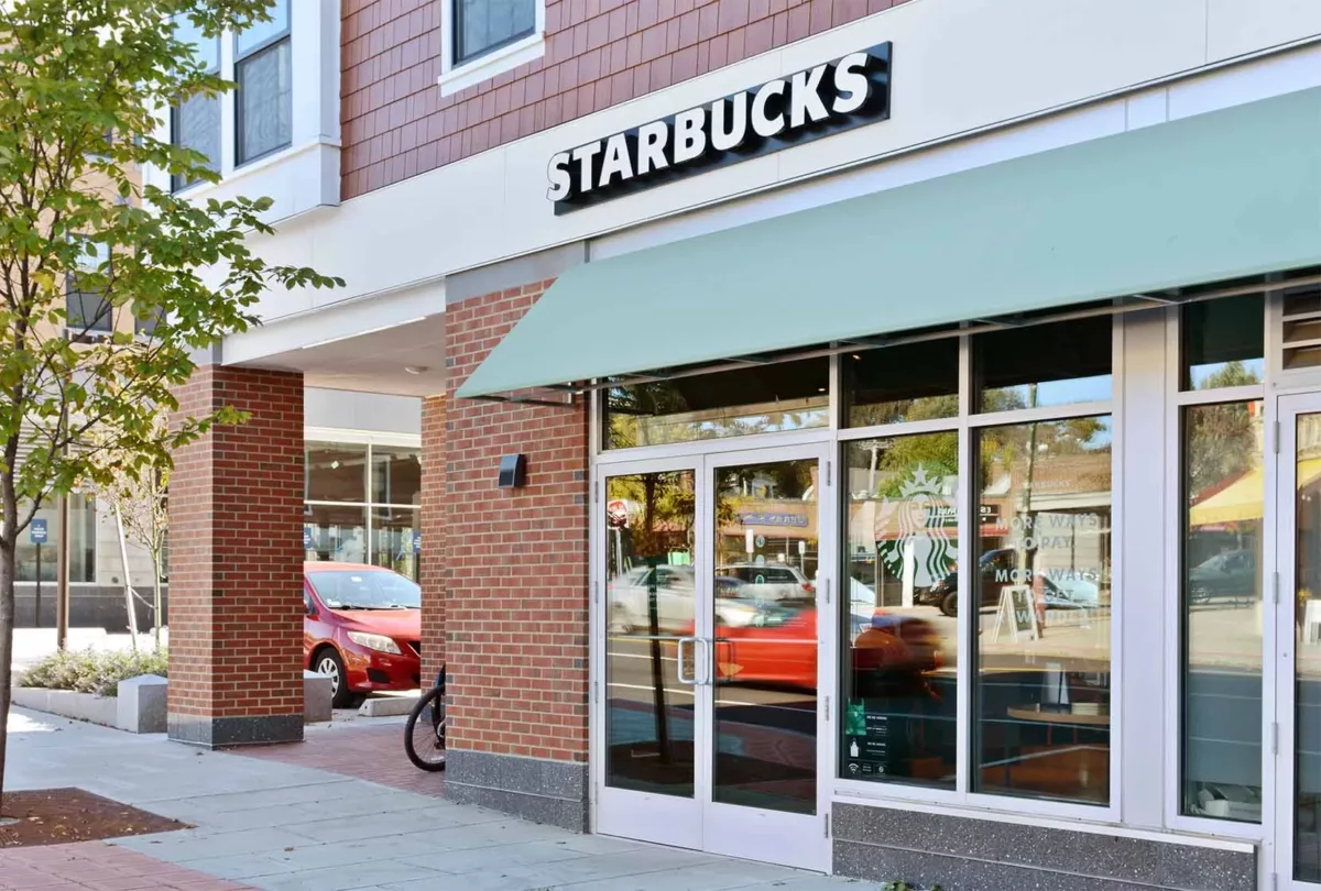 Exterior view of Starbucks in the neighborhood of The Bradford luxury apartments