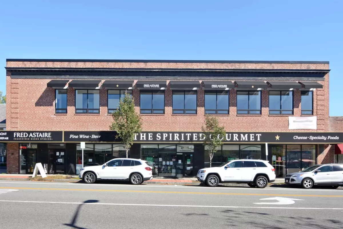 Exterior window view of The Spirited Gourmet, in the neighborhood of The Bradford luxury apartments