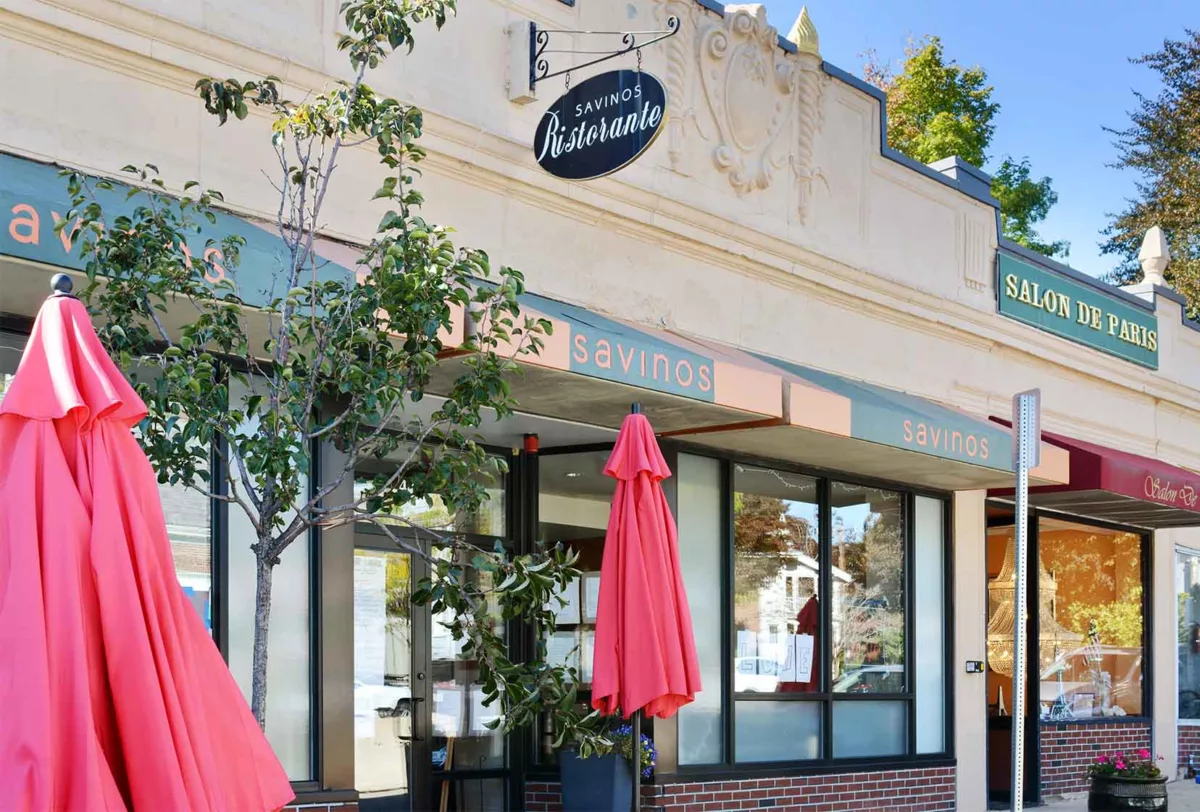 Red umbrella's outside of Savinos Ristorante and Salon De Paris building